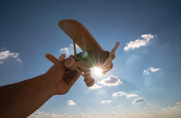 wooden toy plane through the sky ecological concept sustainability