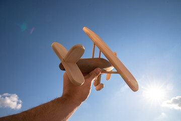 wooden toy plane through the sky ecological concept sustainability