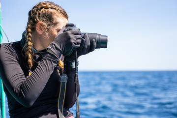 Profile of a concentrated marine biologist talking photos
