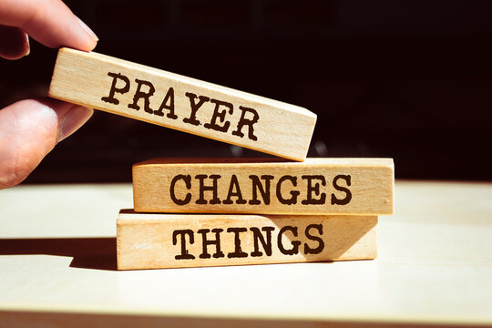 Wooden blocks with words 'Prayer Changes Things'.