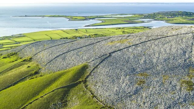 Aerial view of Cong Village surrounded by agricultural fields along Lough Corrib lake, Ireland.
