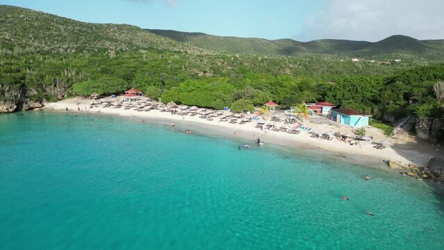 Aerial drone footage over Grote Knip in West Punt Curaca. Carribean beach drop down footage over the clear sea and sand