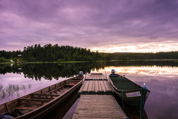 Peaceful landscape of Lake Inari with the midnight sun in Lapland, Finland