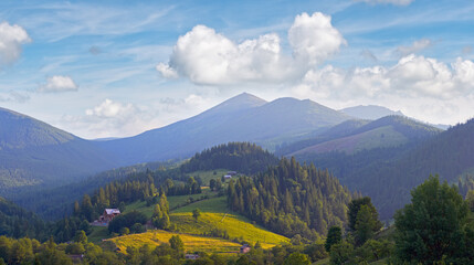 View on morning summer mountain village.