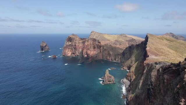 Beautiful aerial or drone shot of "Ponta de Sao Lourenco" in Madeira island in Portugal. Amazing cliffs and blue ocean waves. Flying forward