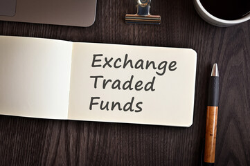 There is notebook with the word Exchange Traded Funds. It is an eye-catching image.