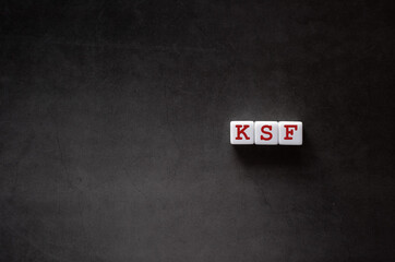 There is white cube with the word KSF. It is an abbreviation for Key Success Factor as eye-catching...
