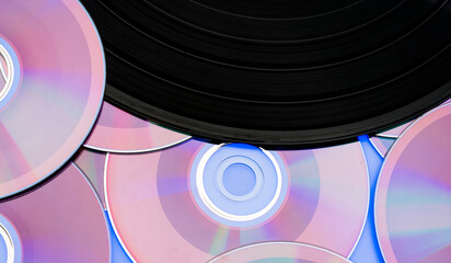 beautiful background with a vinyl record and CDs. music entertainment technology concept