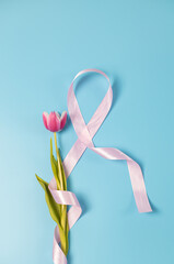 One pink ribbon with a tulip on a blue background.