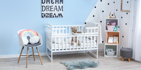 Stylish interior of modern children's room with bed and toys