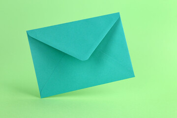 Paper envelope on green background