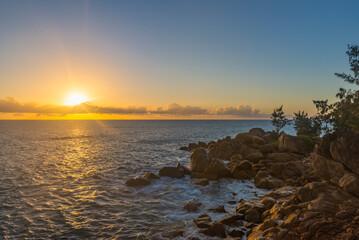 A setting sun viewed from Pointe Ste Marie on Praslin island in Seychelles