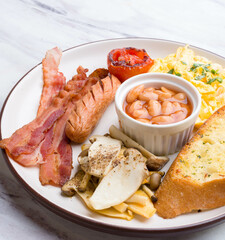 English Breakfast Style ham sausage omelet white peanut and bread on  white marble Table 