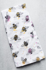 Kitchen napkin with pink and yellow bee designs, bee themed kitchen towels, possible merch for beehive fans