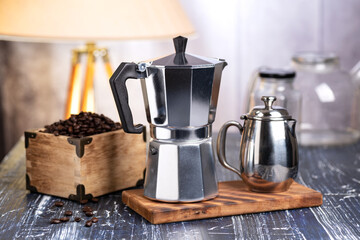 Grains of fragrant coffee and geyser coffee maker. The process of making coffee in a geyser coffee...