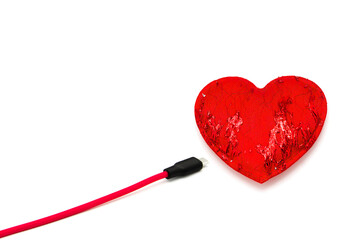 Red heart connected to usb cable isolated on white background.	