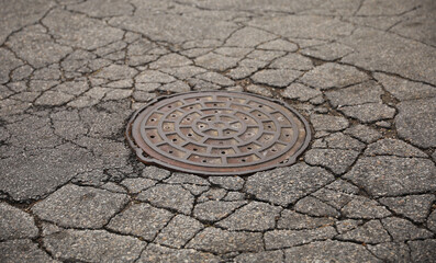 Manhole in the city town made of metal cover