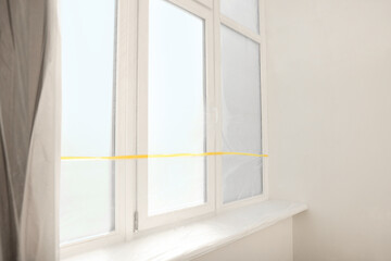 Obraz na płótnie Canvas Window covered with polyethylene film. Protection during repair