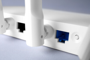 Wi-Fi router on light grey background, closeup