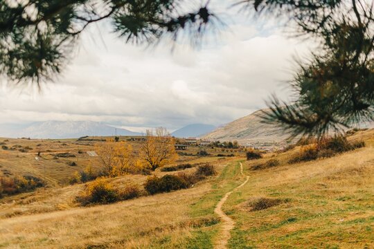 Landscape view of hills and mountain and far city of Korce, Albania