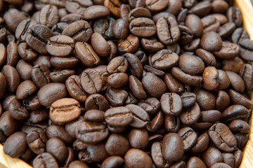 coffee beans in heart-shaped tra,y representing love of coffee