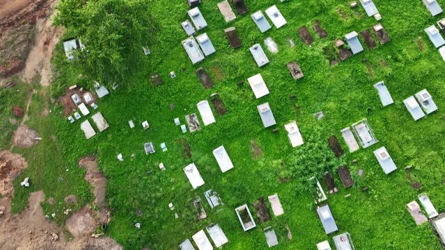 Aerial view over a cemetery in Africa, Forward flyby