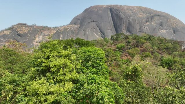 Aerial - Descending wide shot of a Aso rock in a national park