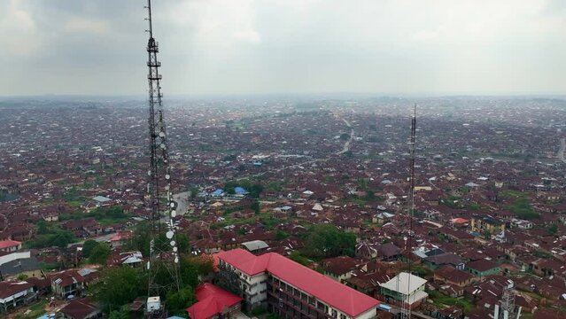Aerial - Wide shot of the ancient city of Ibadan, reverse tilting wide shot