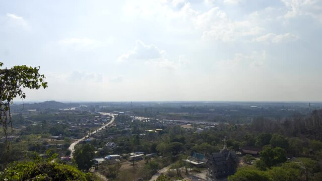 Time lapse above small town and Buddhist temple in Thailand