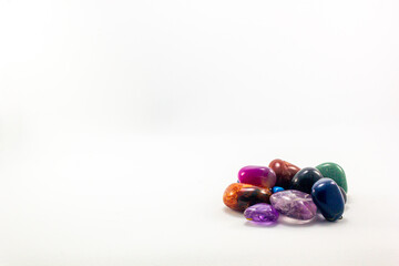 color jewelry gemstones pile white background