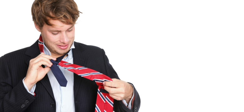 Necktie - man can not tie his tie. Young professional business man trying tying his tie getting ready isolated in transparent PNG. Funny young Caucasian business man model.