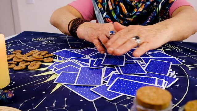 Fortune teller woman reads tarot cards. Selective focus.
