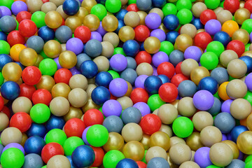 Fototapeta na wymiar A bunch of colorful plastic balls in the game center. View from above. A place to copy