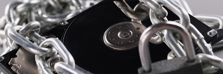 Computer hard drive is wrapped in chain