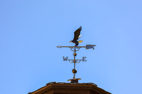 An eagle weather vane on top of a gazebo roof in Big Bear Lake, California.