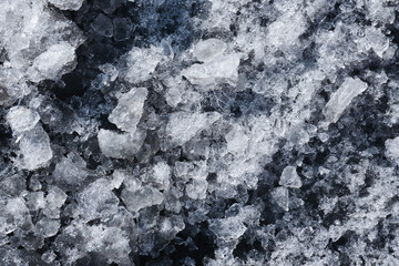 Snow background. Ice texture. Winter seanson pattern. Pile of snow. Crystal snowflake shine.	
Frozen puddle. Small pieces of ice. Cracked water freeze.