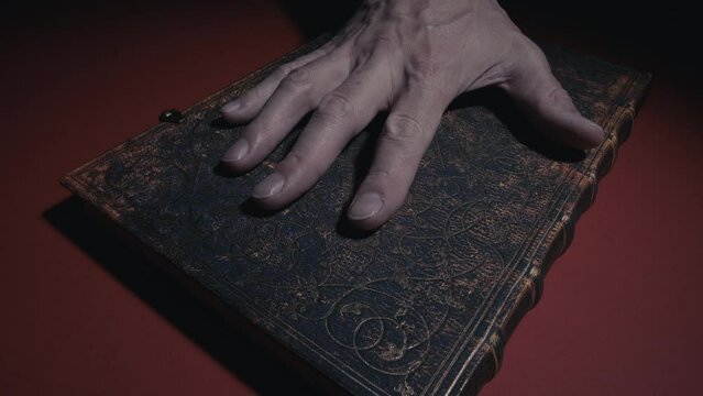 praying hands on a book