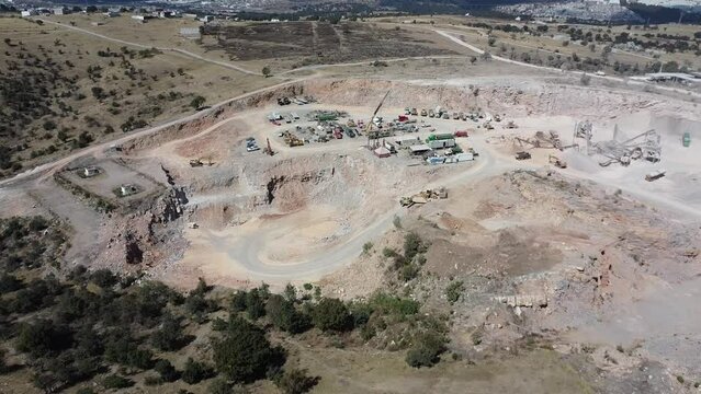 aerial shot of a lime mine in a latinoamerican town, mexico, industry