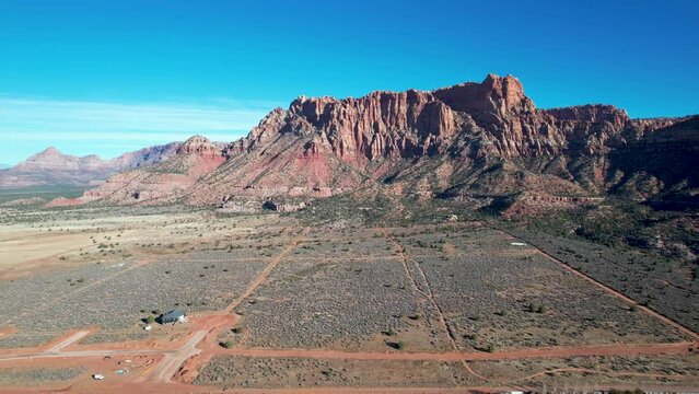Colorado City Utah small town with red rock cliffs and dirt roads - aerial