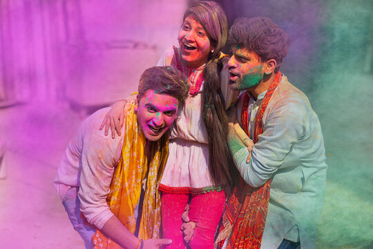 A group of friends  celebrating holi in outdoor