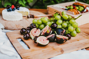 Grapes and figs on board, fresh fruit or Appetizers table in Mexico Latin America