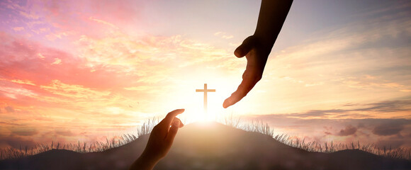 God's helping hand and cross on sunset background
