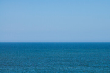 Water and sky both are blue but with different tones and patterns.