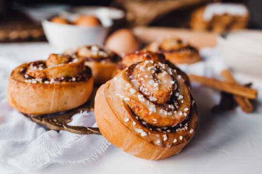 cinnamon rolls recipe and ingredients at table
