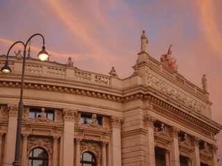 The Burgtheater is court theater in Vienna Hofburg. one of oldest theaters not only in Austria, but throughout Europe. over sunset sky