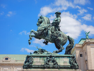 Obraz premium Statue of Prince Eugene in front of Hofburg palace on Heldenplatz square, center of Vienna, Austria