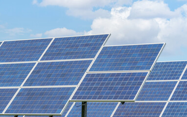 solar cells or photovoltaic cells in power station turn up to sunlight alternative renewable energy from the sun