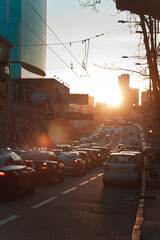 Evening rush hour cityscape photo. Cars on roadway. Beautiful urban scenery photography with blurred background. Street scene. High quality picture for wallpaper, travel blog, magazine, article