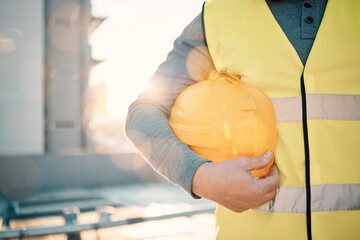 Engineering, helmet and hands of construction worker in lens flare for urban development and architecture mission. Building contractor, builder person or technician with safety gear on city rooftop - obrazy, fototapety, plakaty