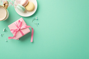 Spring presents concept. Top view photo of pink giftbox with ribbon bow plate with macarons cup of...